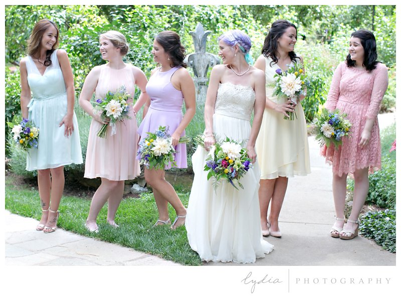 Bride and bridesmaids with bouquets at Harmony Ridge Lodge wedding in Grass Valley, California.