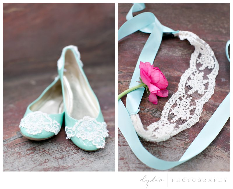 Bride's mint green wedding shoes and ribbon, lace hairpiece at Harmony Ridge Lodge in Grass Valley, California.