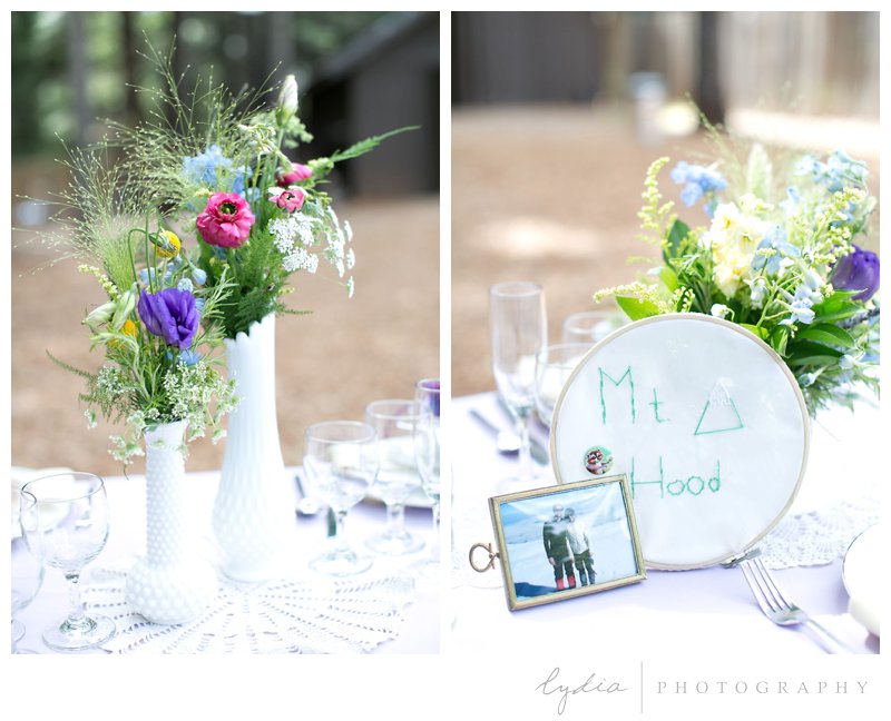 Table decoration with pictures of the bride and groom at Harmony Ridge Lodge in Grass Valley, California.