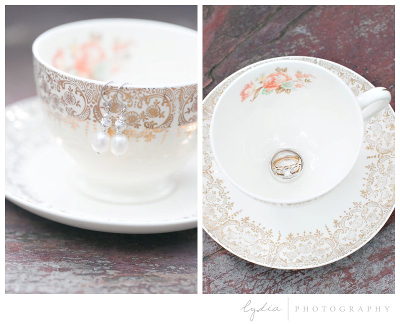 Earrings and wedding rings in a vintage teacup at Harmony Ridge Lodge in Grass Valley, California.