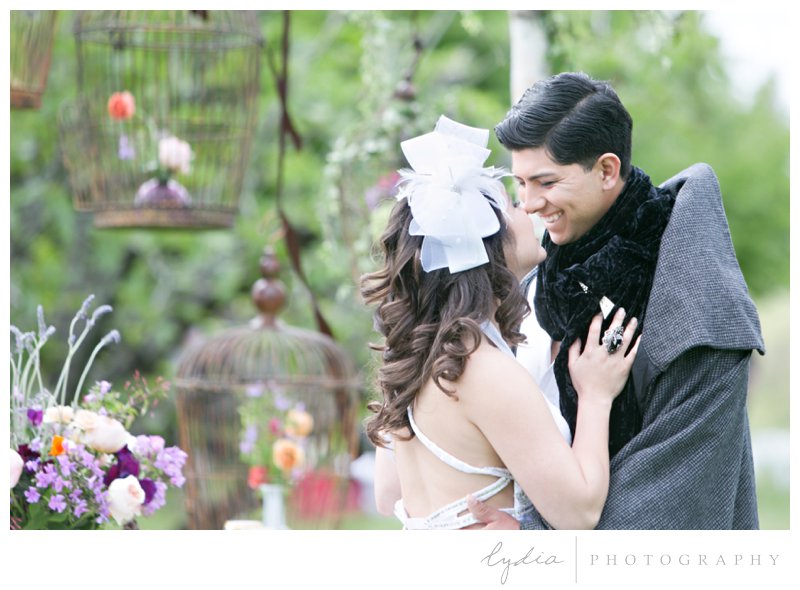 Bride and groom Eskimo kissing at French Country wedding at North Star House in Grass Valley, California.