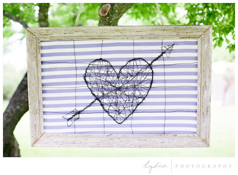 Framed metal heart art at French Countryside wedding at North Star House in Grass Valley, California.