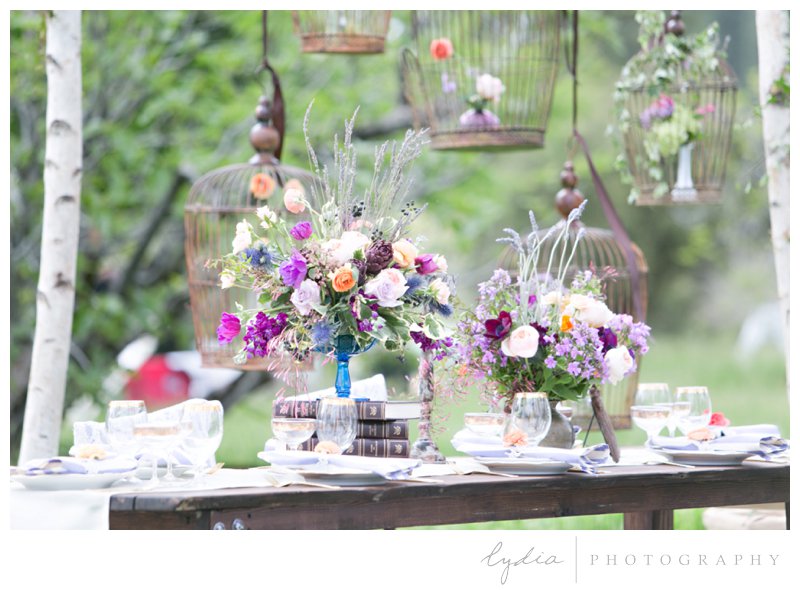 European style reception table setting in orchard at French Countryside wedding at North Star House in Grass Valley, California.