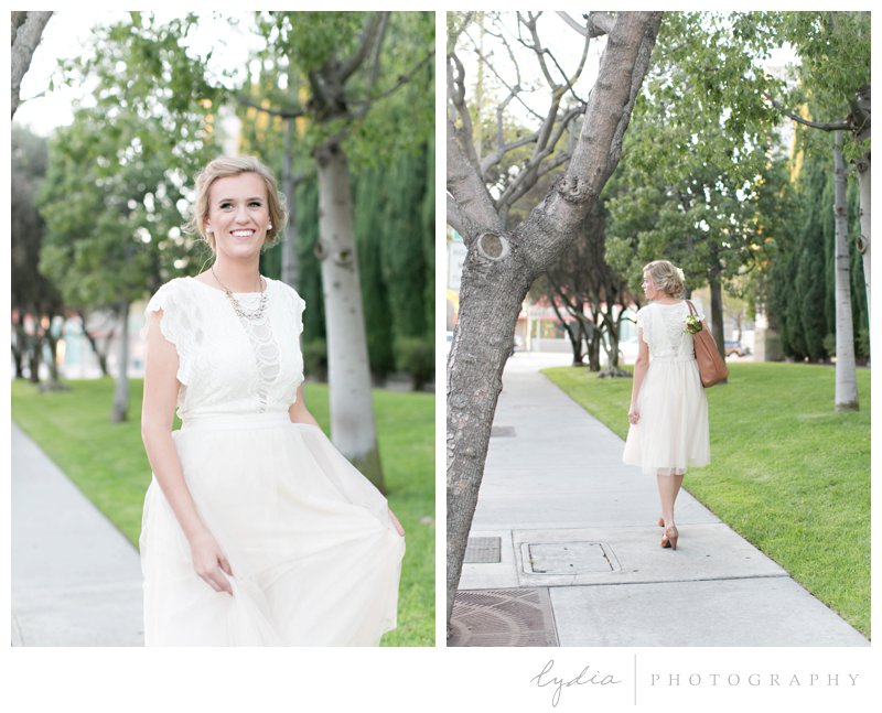 Bride walking on a side walk with a purse for a Hollywood bridal portraits at Los Angeles, California.