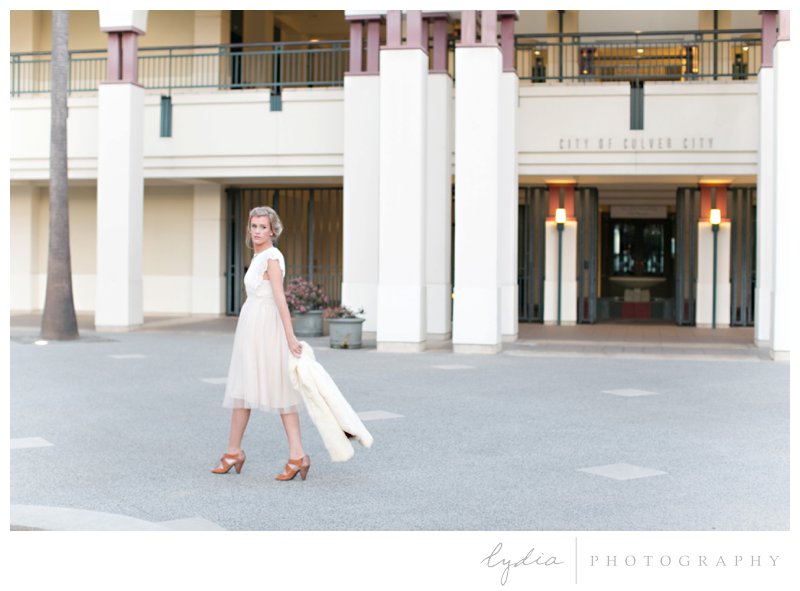 Bride walking with the fur coat for a Hollywood bridal portraits at Los Angeles, California.