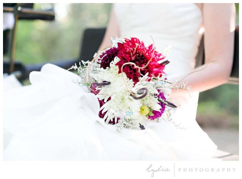 Bride with flower bouquet for a modern wedding at Empire Mine in Grass Valley, California.