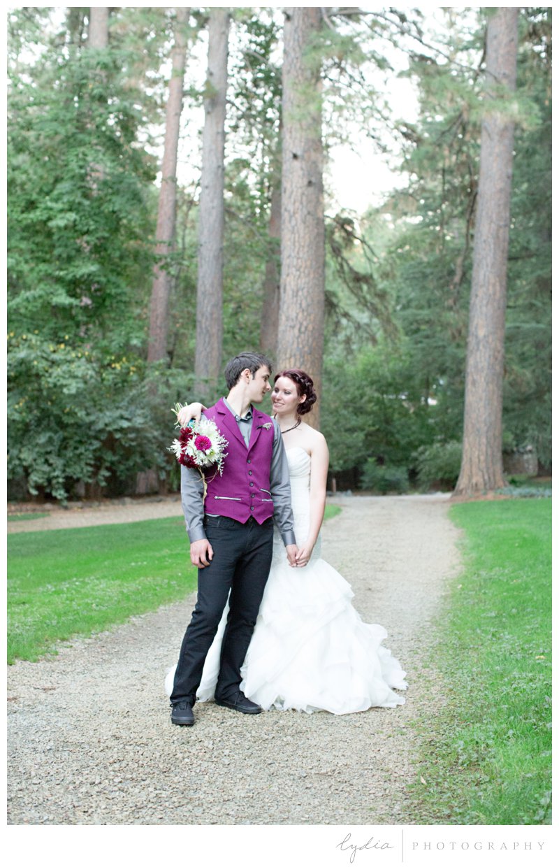Bride and groom on a path for a modern wedding at Empire Mine in Grass Valley, California.