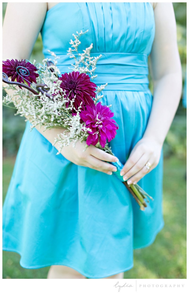 Bridesmaid with bouquet for a modern wedding at Empire Mine in Grass Valley, California.