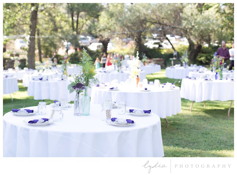 Reception tables at a barn wedding at Squirrel Creek Ranch in Grass Valley, California.
