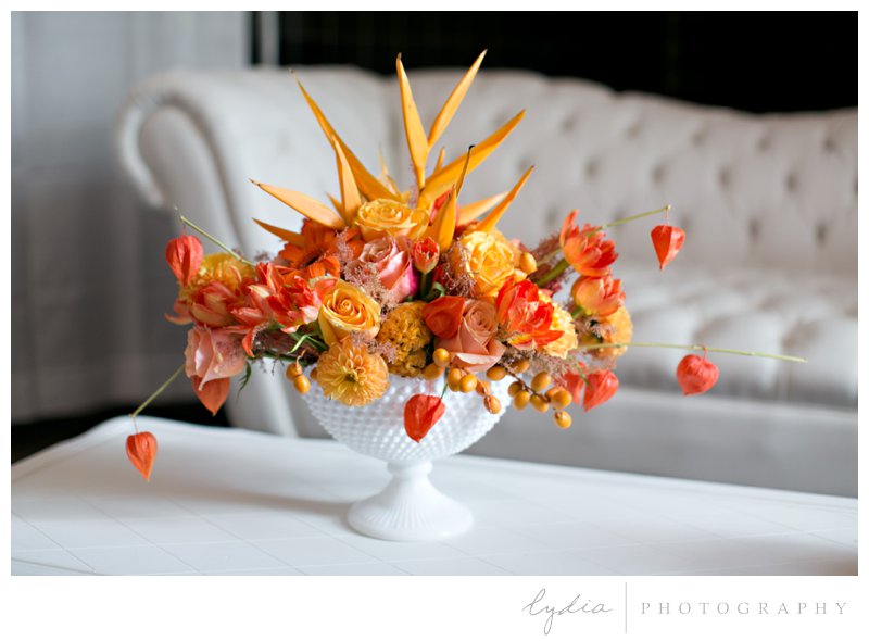 Orange rose Art Deco floral arrangeent at Veterans Hall ombre wedding bridal show in Grass Valley, California.