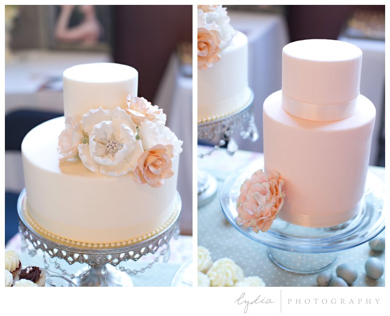 Simple, elegant cream and blush wedding cakes with sugar roses and peonies at Veterans Hall bridal show in Grass Valley, California.