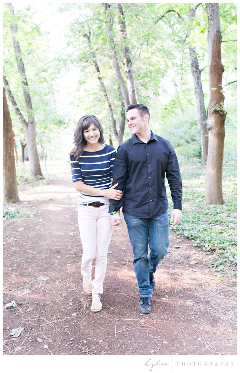 Bride and groom walking at Empire Mine engagement portraits in Grass Valley, California.