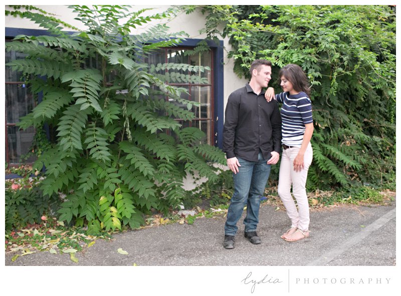 Bride and groom at engagement portrait session in downtown Grass Valley, California.