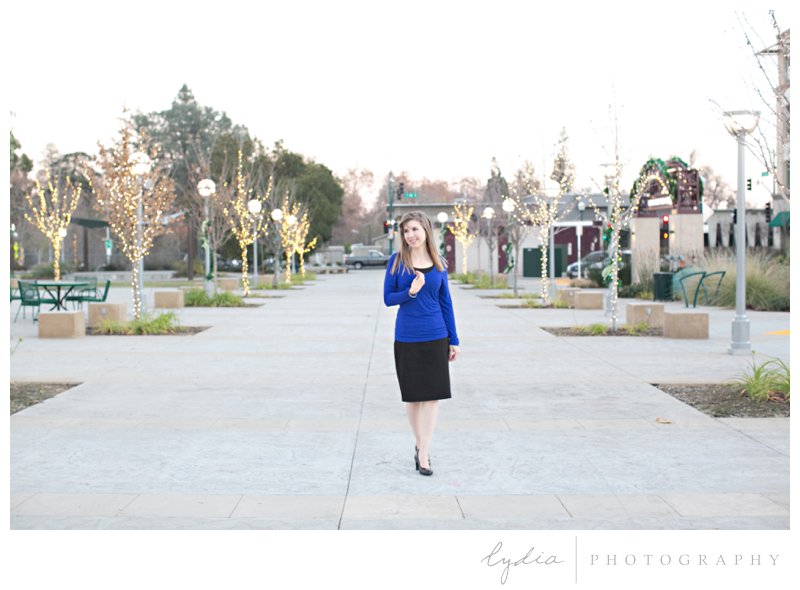 Girl walking through town square for BJU senior portraits at Whitney Oaks in Rocklin, California.
