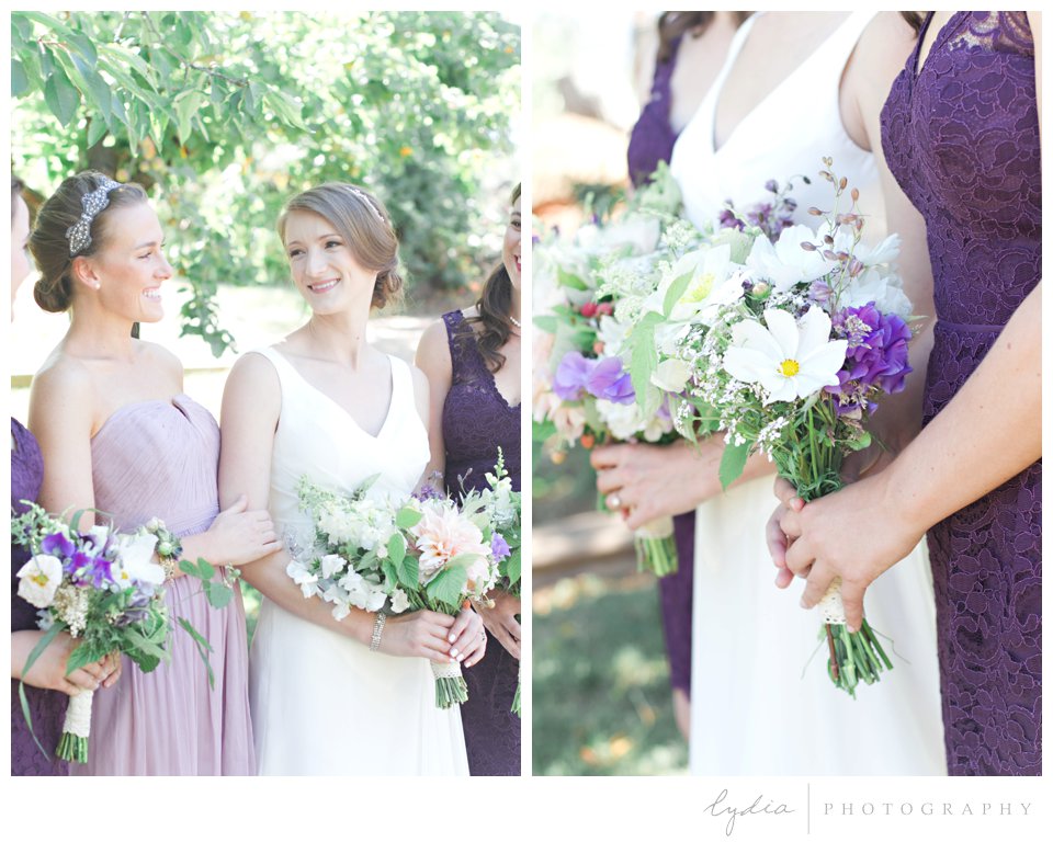 Bride and bridesmaids holding wedding bouquets at Lucchesi Vineyards in Grass Valley, California.