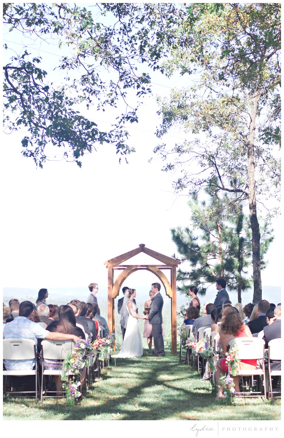 Bride and groom saying vows at Lucchesi Vineyards in Grass Valley, California.
