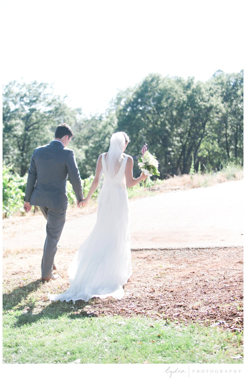 Bride and groom recessional at Lucchesi Vineyards in Grass Valley, California.