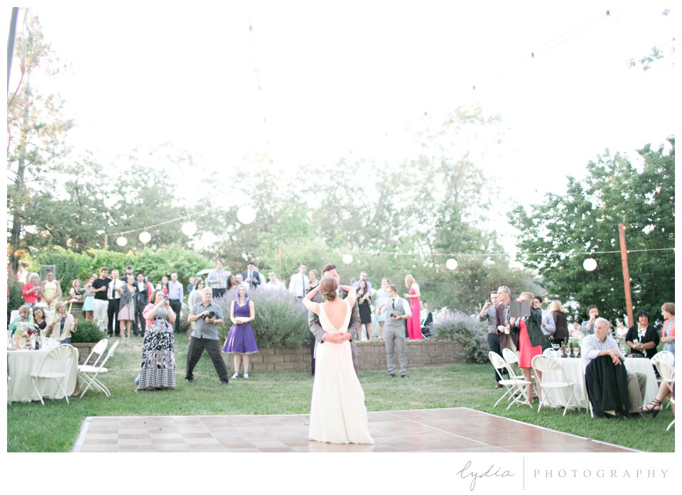 Bride and groom dancing at reception at Lucchesi Vineyards wedding in Grass Valley, California.