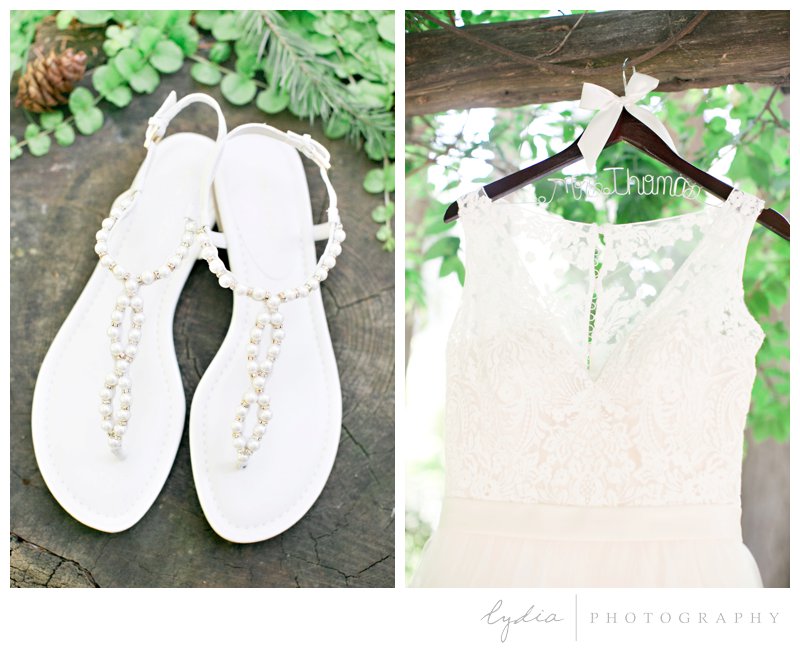 Sandals and wedding dress in the Tahoe forest at Harmony Ridge Lodge in Nevada City, California.