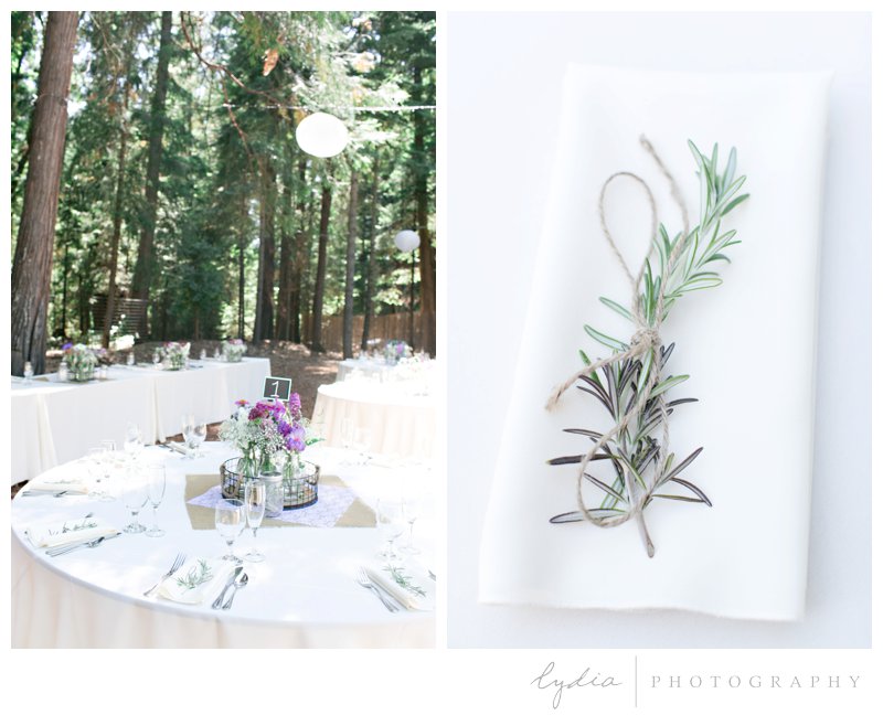 Reception tables and decorations in the Tahoe forest at Harmony Ridge Lodge in Nevada City, California.