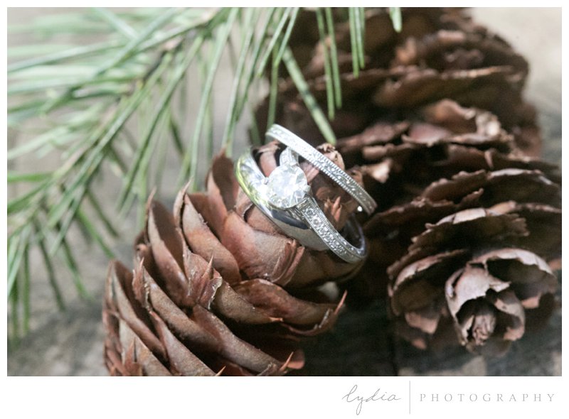 Wedding and engagement rings in the Tahoe forest at Harmony Ridge Lodge in Nevada City, California.