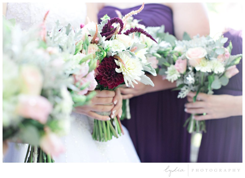 Bride and bridesmaids' bouquets at Northern Queen Inn Wedding in Nevada City, California.