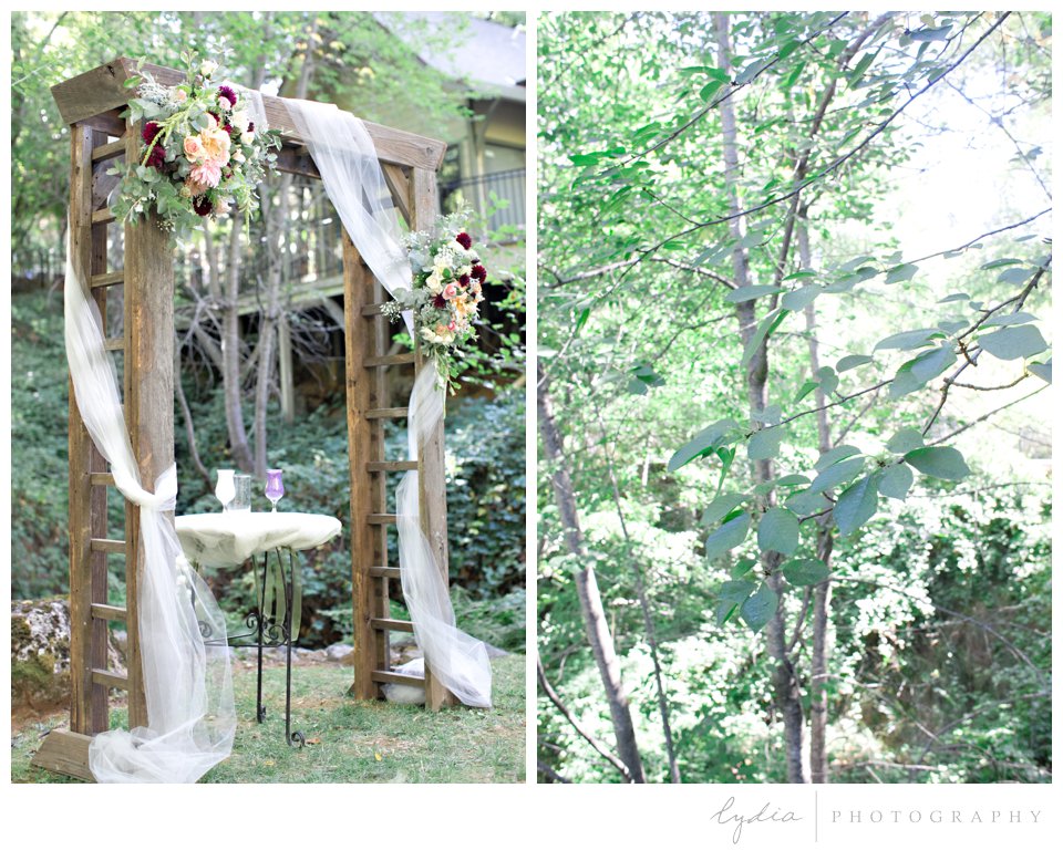 Rustic wooden arch and floral swags at Northern Queen Inn Wedding in Nevada City, California.
