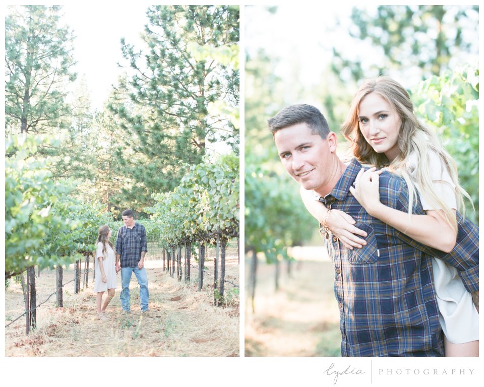 Wife and husband around grapes at Smith Vineyard wedding anniversary portrait shoot in Grass Valley, California.