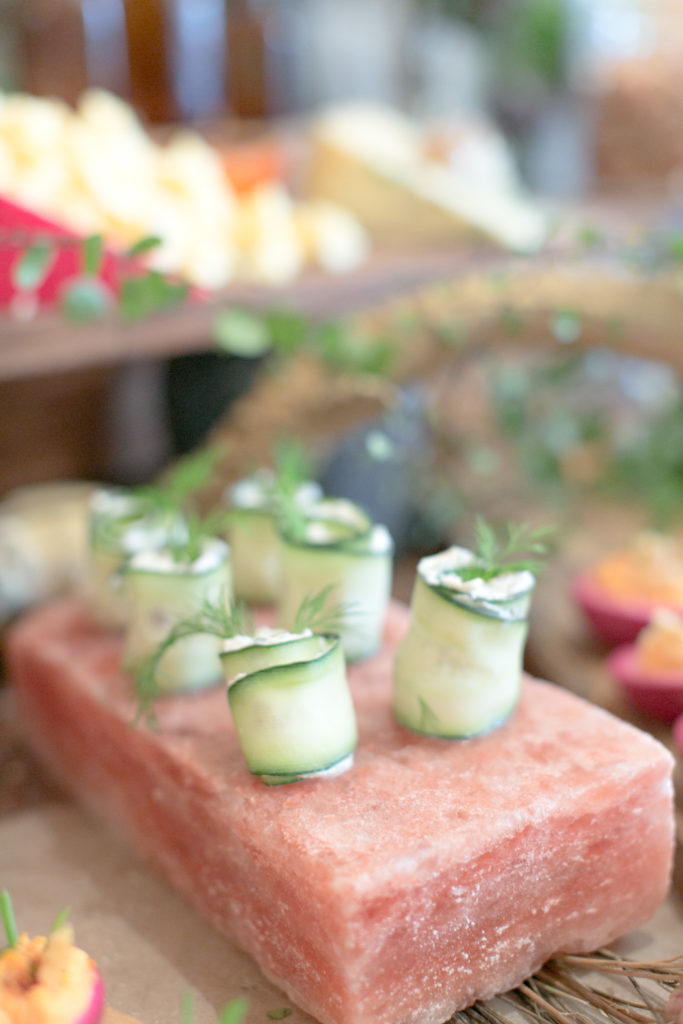 Wedding cucumber hors d'oeuvres rolls on pink salt block