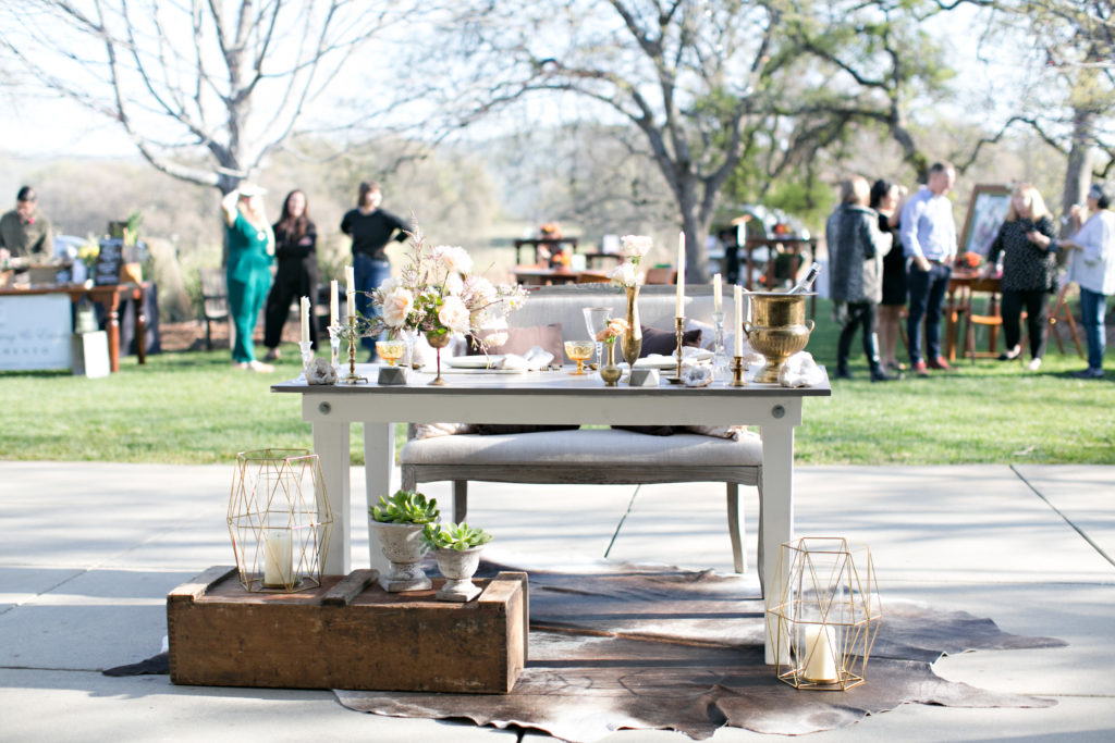 Vintage sweetheart table for bride and groom at River Highlands Ranch wedding