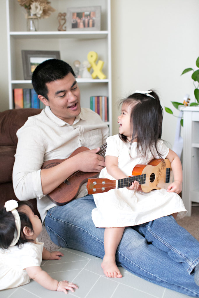 Dad and daughter playing guitars at Sacramento lifestyle family portraits