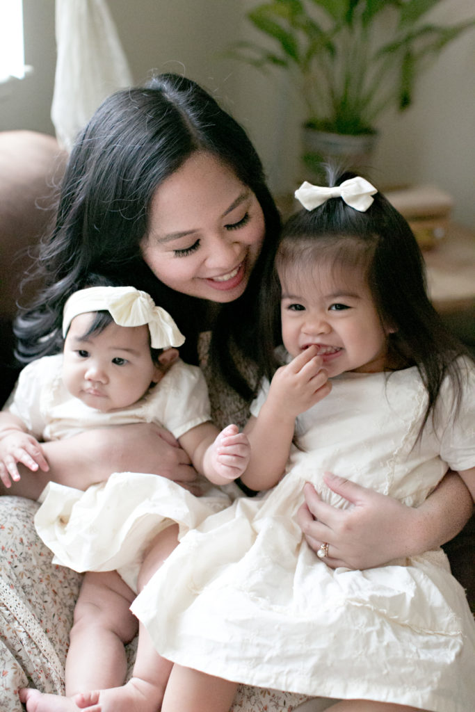 Mother hugging daughters at Sacramento lifestyle family portraits